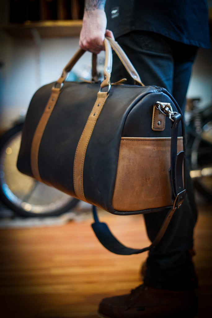 Full grain handmade leather duffle bag. Two tone color. Made in Canada.
