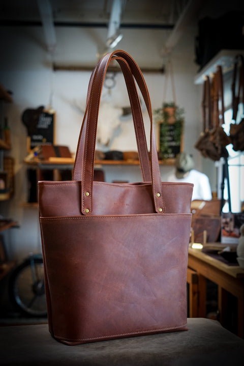 Handmade full grain leather backpack in the color "oro logger brown"
