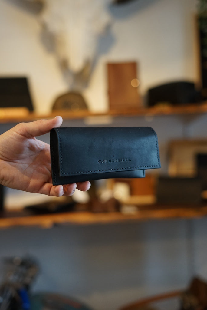 Flat black full grain leather sunglass case with magnetic closure